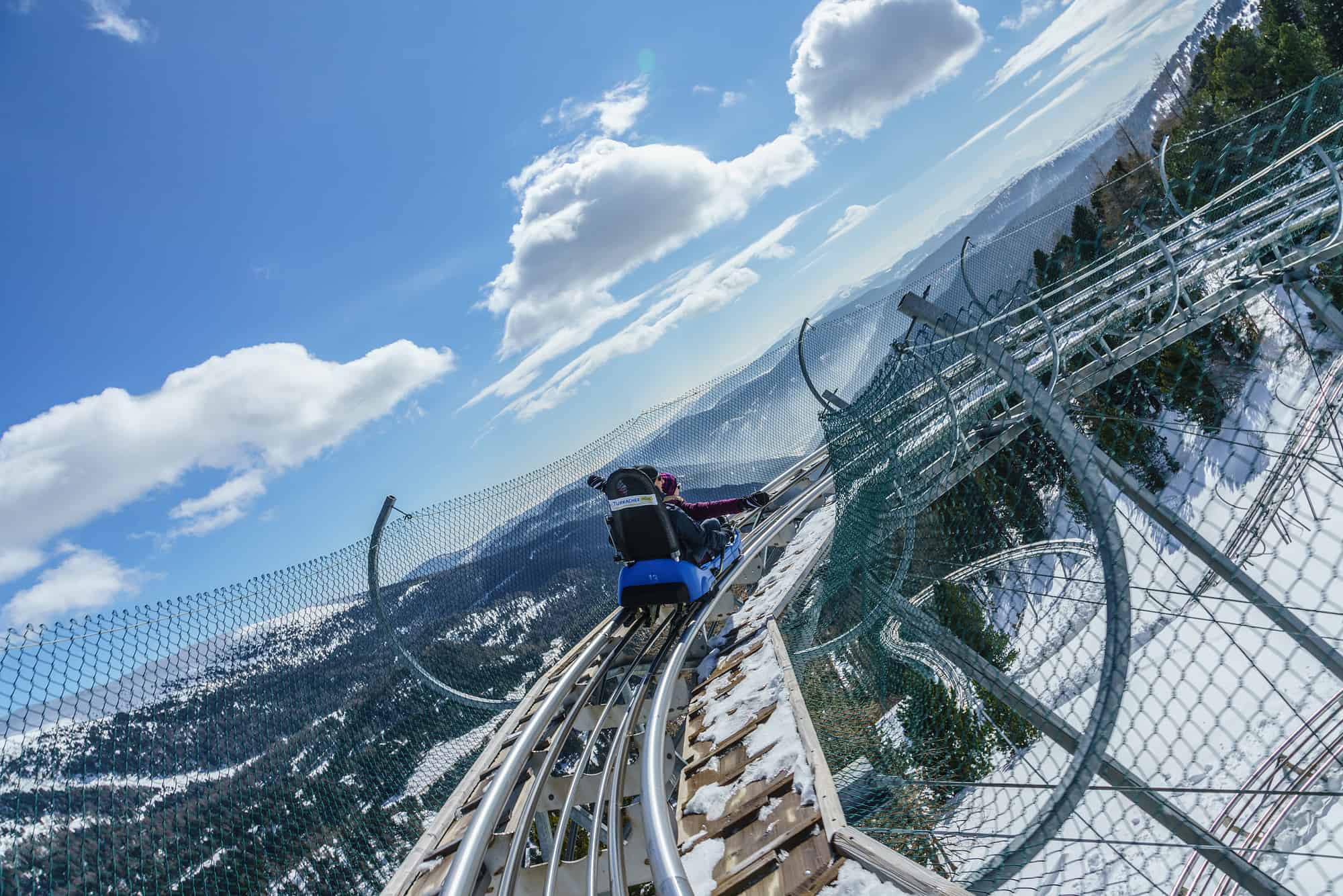 Winter Nocky Flitzer Turracher Höhe Rodelbahn TOP 10 Ausflugsziele Kärnten Talfahrt mit Panoramablick